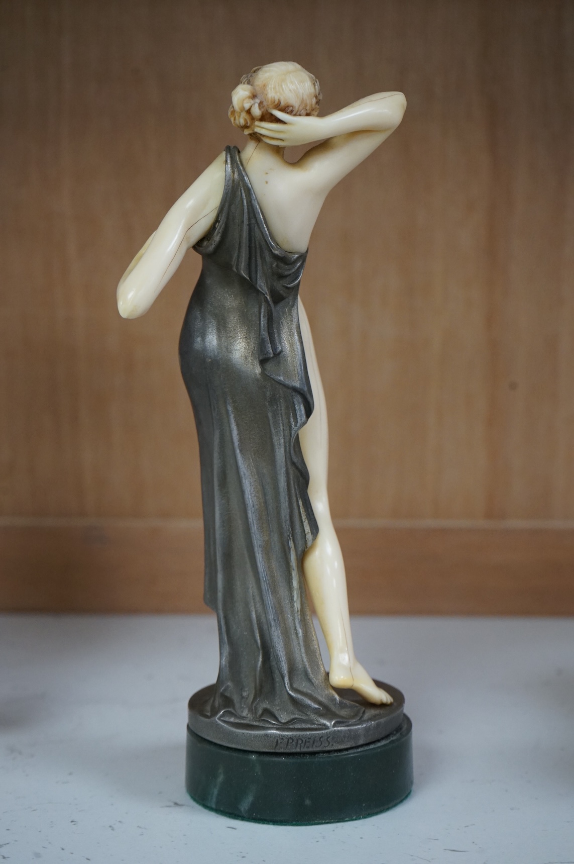 After F. Preiss, an Art Deco style silvered metal and ivorine figure, 'Vanity', 22cm high